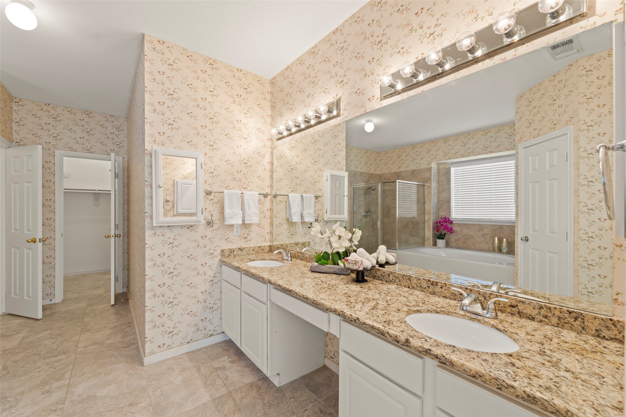 14715 Rancho Vista Drive Houston, TX 77083 - Photo 20 of 38 a bathroom with a granite countertop sink and a mirror
