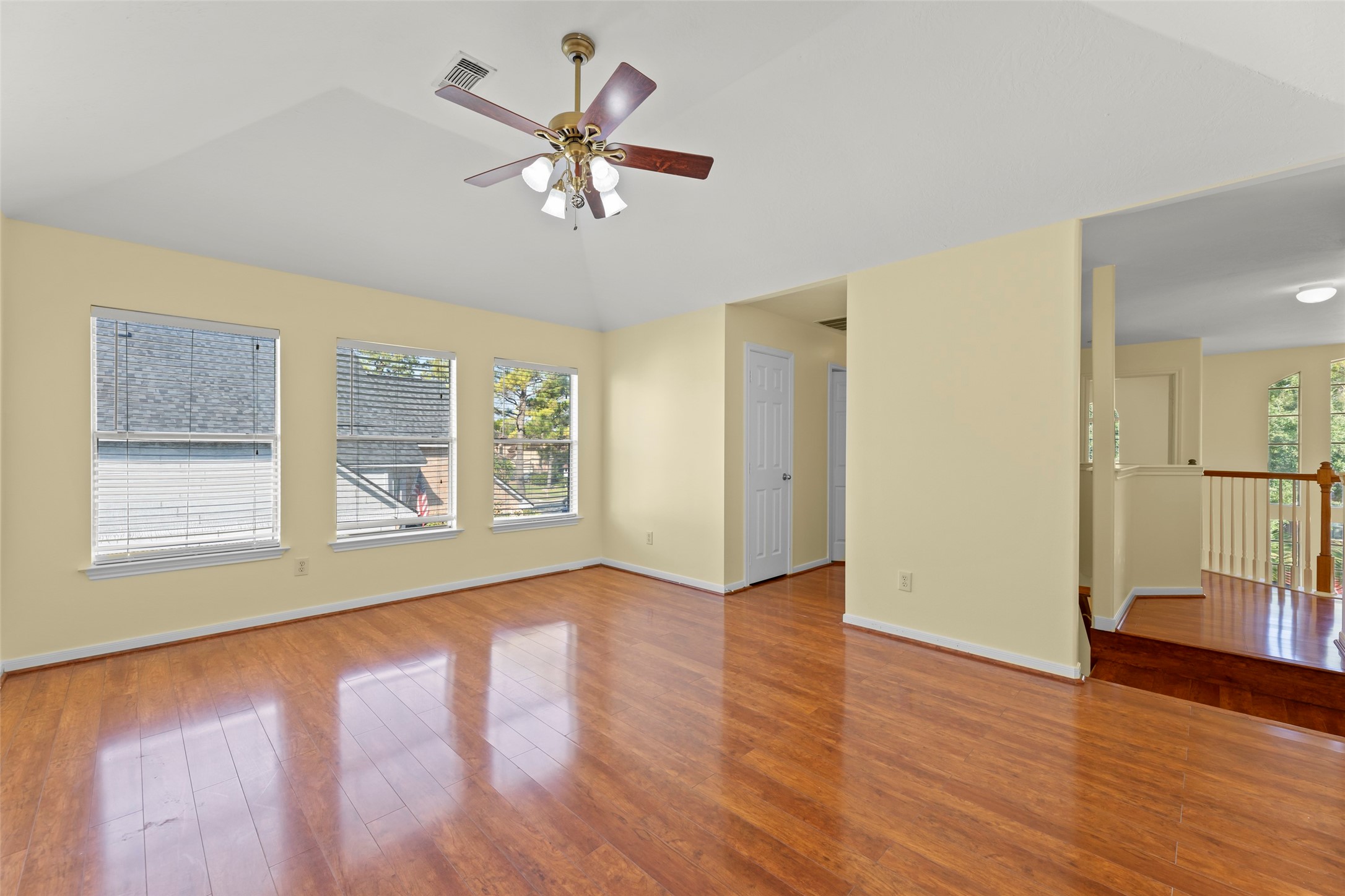 14715 Rancho Vista Drive Houston, TX 77083 - Photo 23 of 38 a view of an empty room with wooden floor and a window