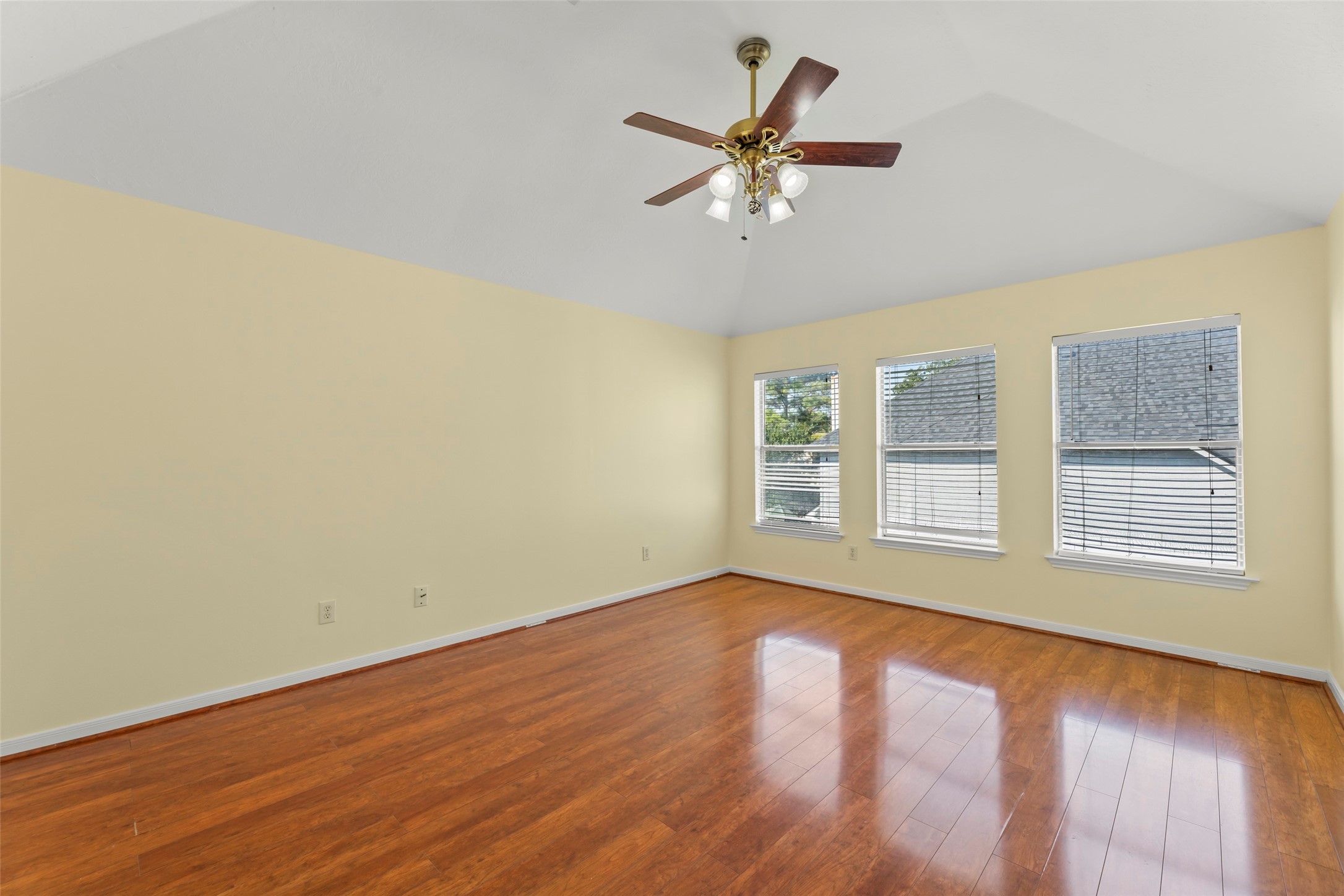 14715 Rancho Vista Drive Houston, TX 77083 - Photo 24 of 38 a view of an empty room with wooden floor and a window
