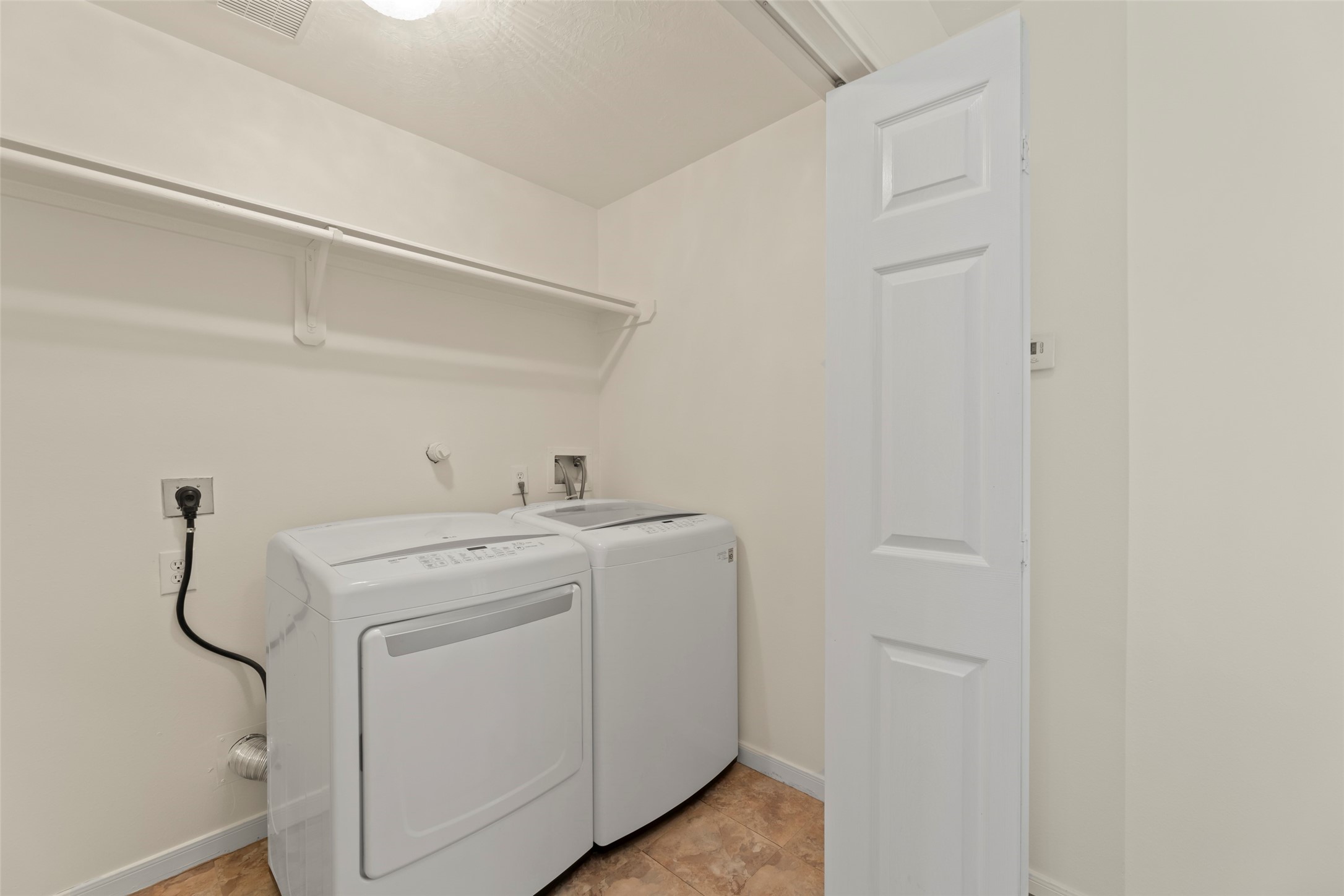 14715 Rancho Vista Drive Houston, TX 77083 - Photo 25 of 38 a utility room with dryer and washer