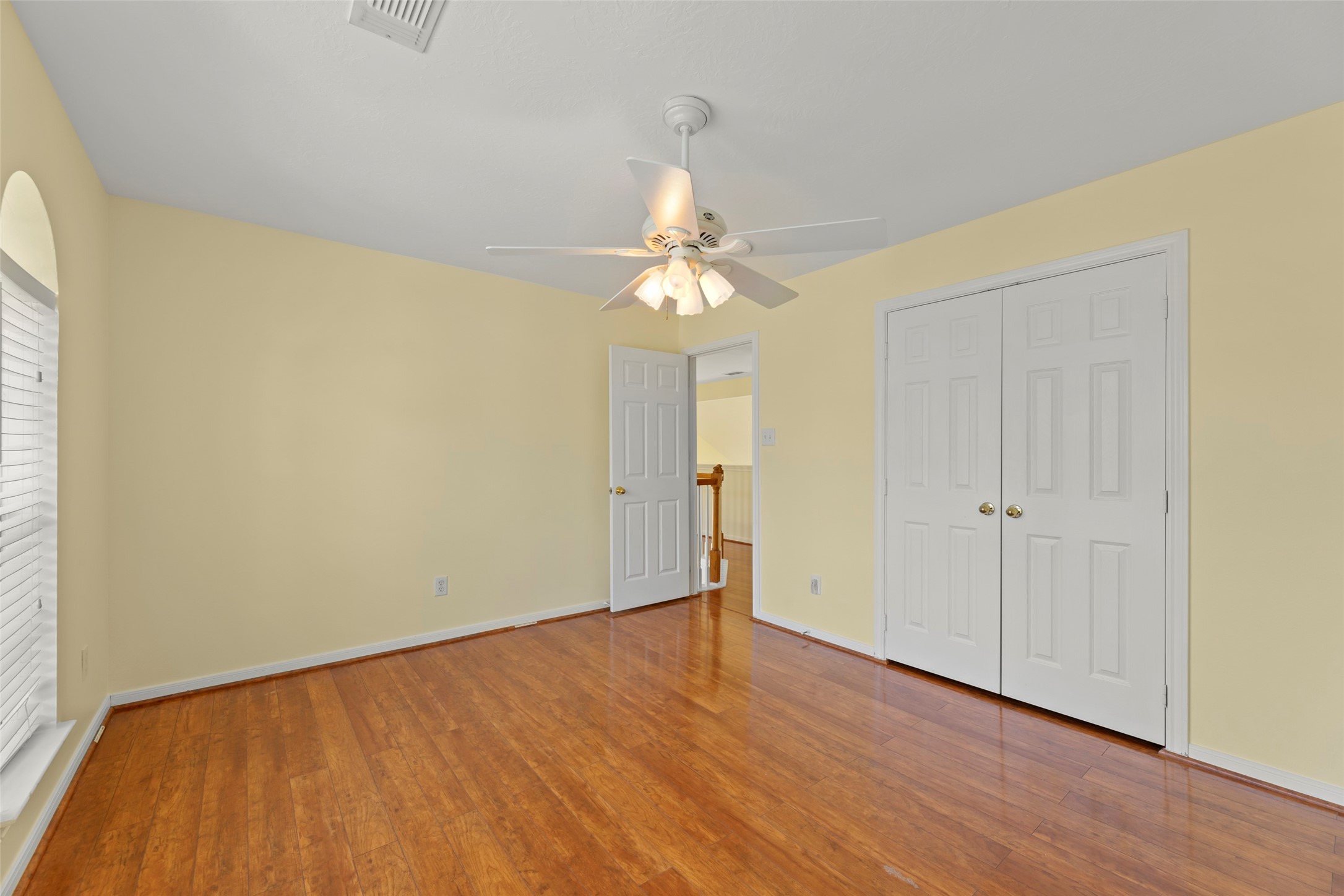 14715 Rancho Vista Drive Houston, TX 77083 - Photo 27 of 38 a view of an empty room with wooden floor and a window