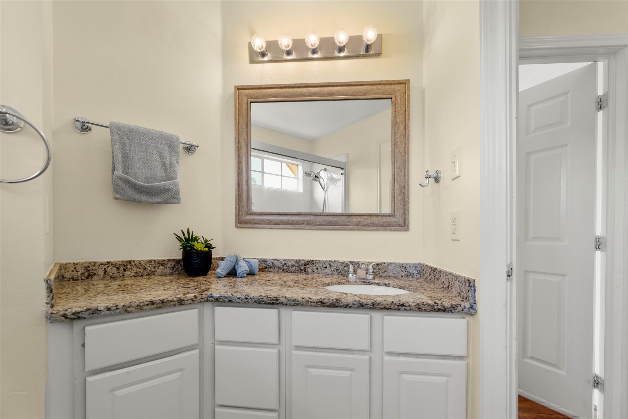 14715 Rancho Vista Drive Houston, TX 77083 - Photo 31 of 38 a bathroom with a granite countertop sink and a mirror