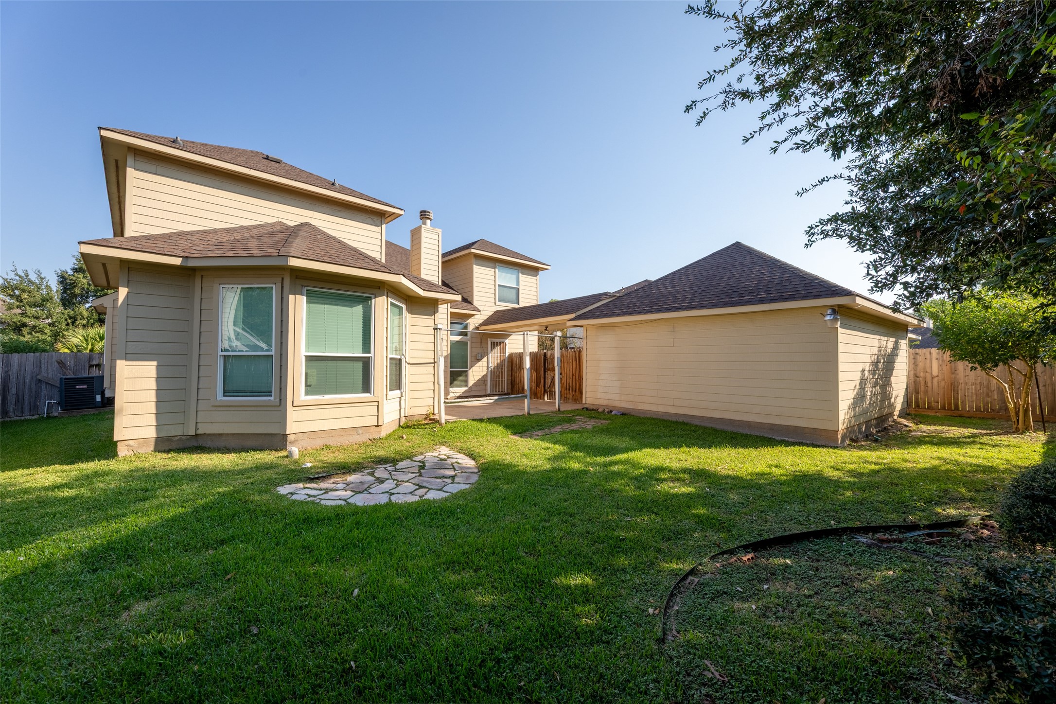 14715 Rancho Vista Drive Houston, TX 77083 - Photo 36 of 38 a front view of a house with a garden