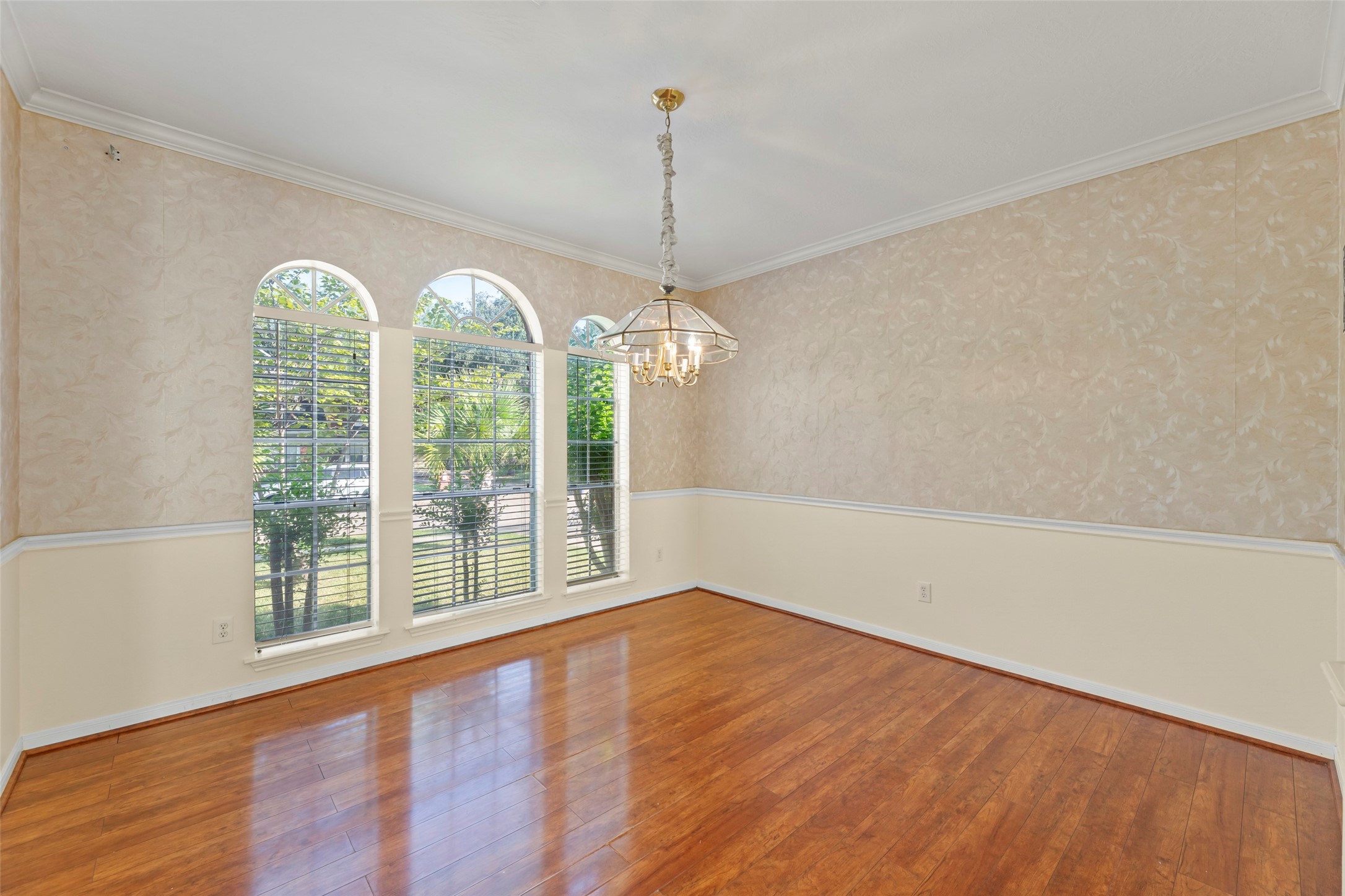 14715 Rancho Vista Drive Houston, TX 77083 - Photo 4 of 38 a view of a room with large windows and wooden floor