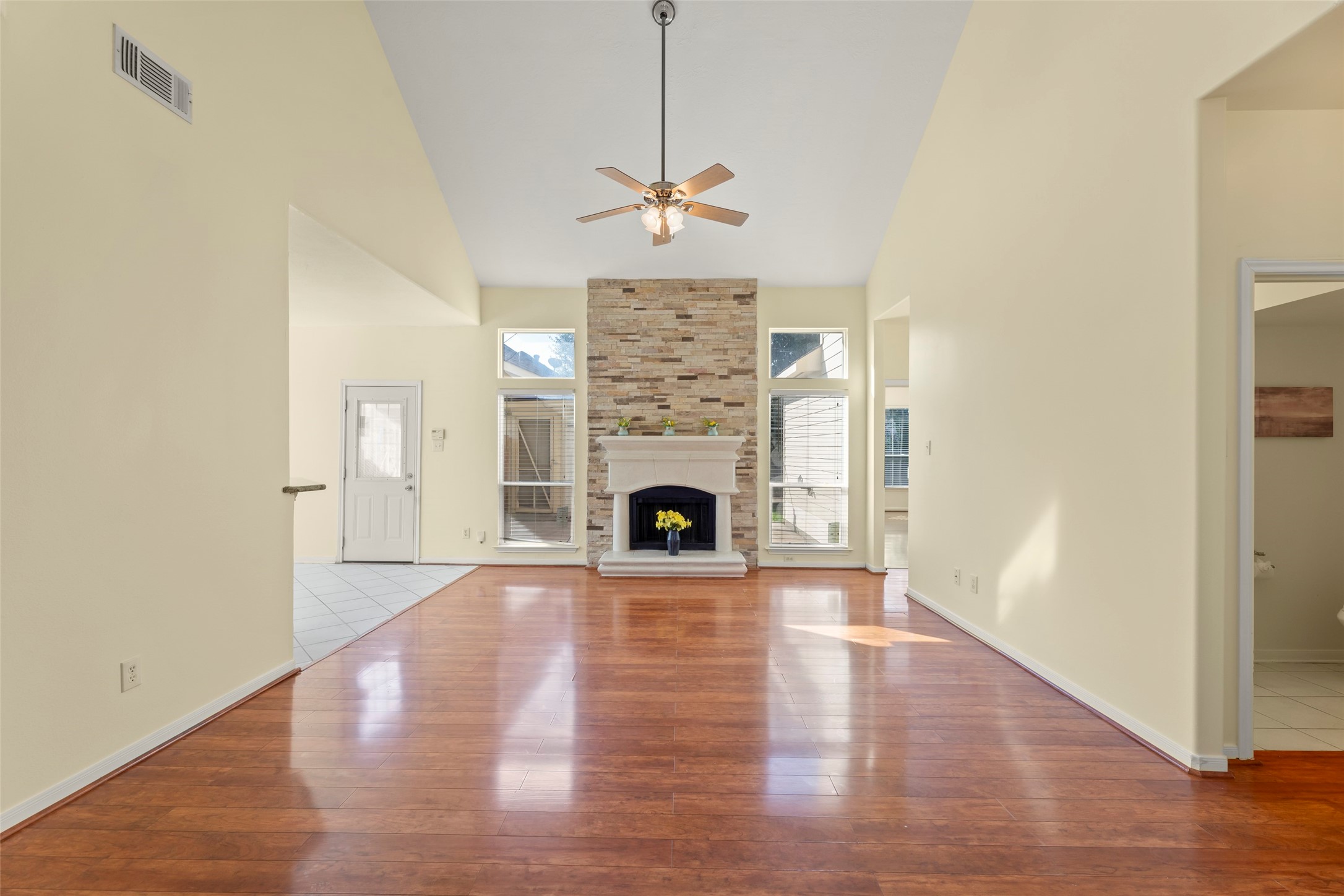 14715 Rancho Vista Drive Houston, TX 77083 - Photo 6 of 38 a view of a livingroom with a fireplace wooden floor and window