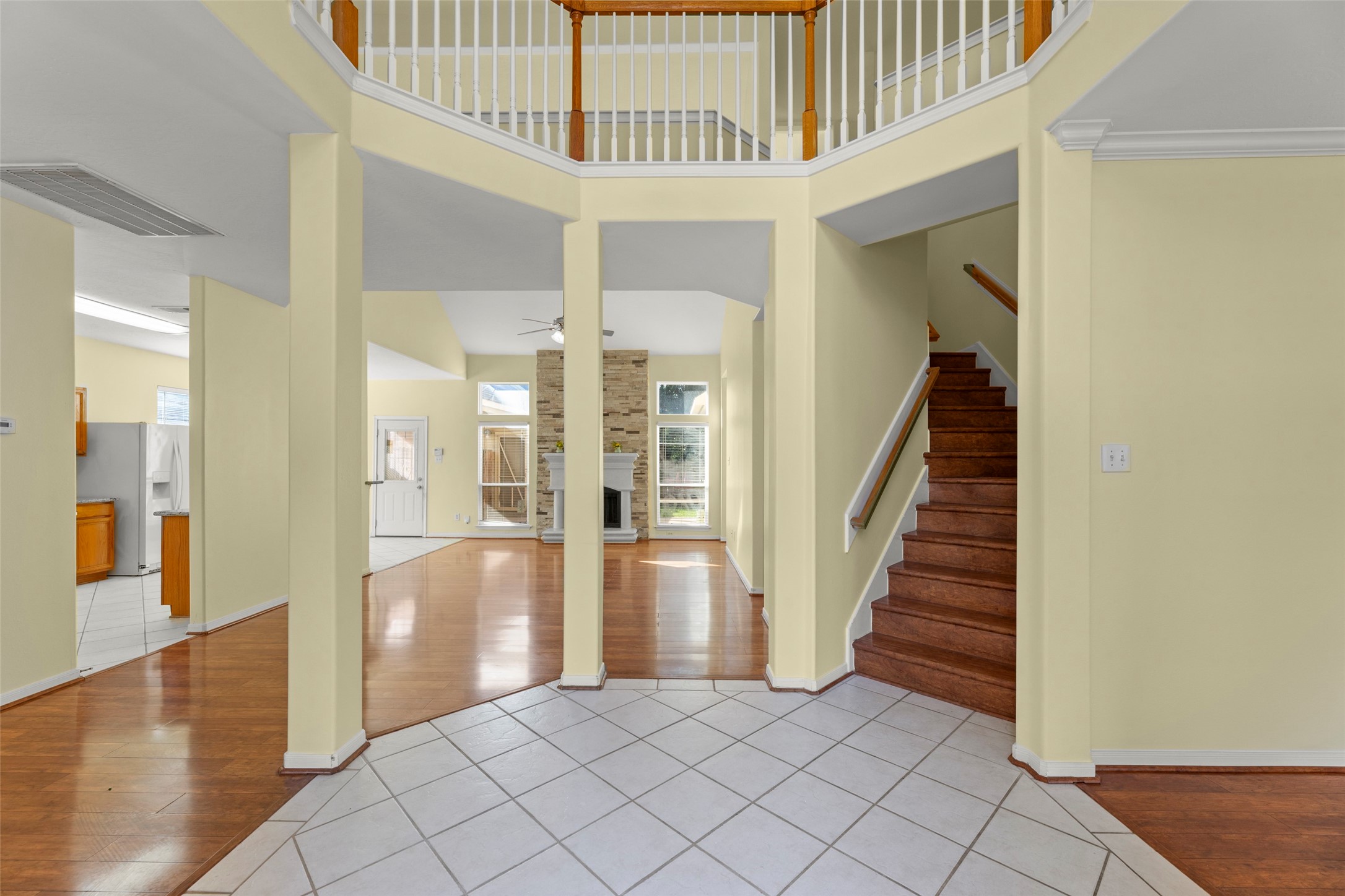 14715 Rancho Vista Drive Houston, TX 77083 - Photo 9 of 38 a view of a hallway with entryway and wooden floor