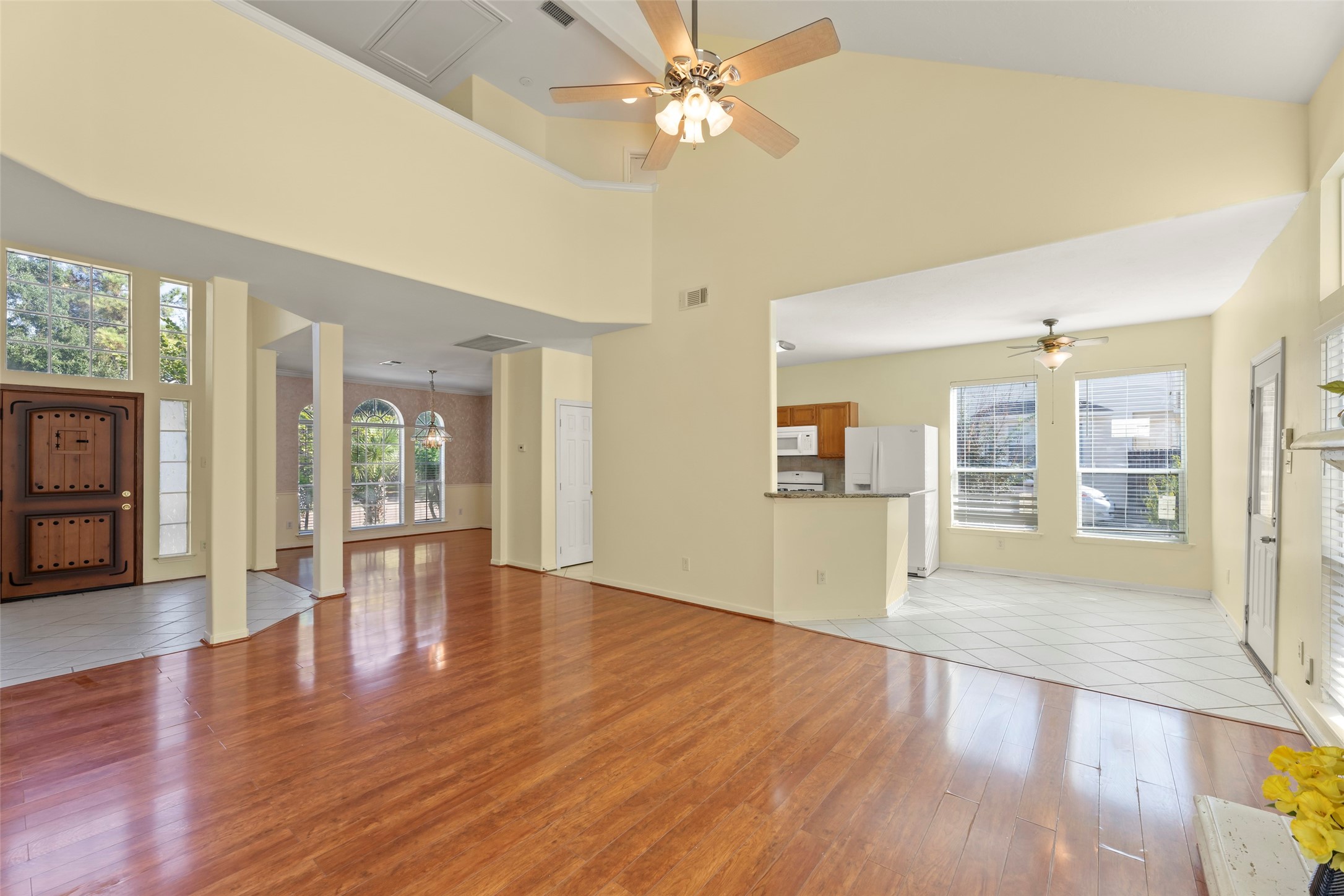 14715 Rancho Vista Drive Houston, TX 77083 - Photo 10 of 38 a view of an empty room with window and wooden floor