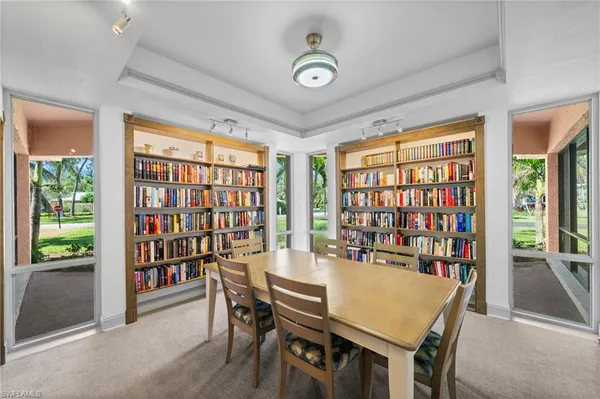 a view of a dining room with furniture window and outside view