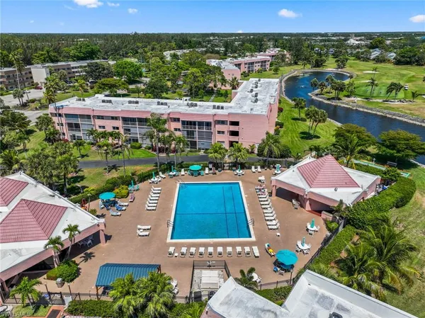 an aerial view of a house with yard swimming pool and outdoor seating