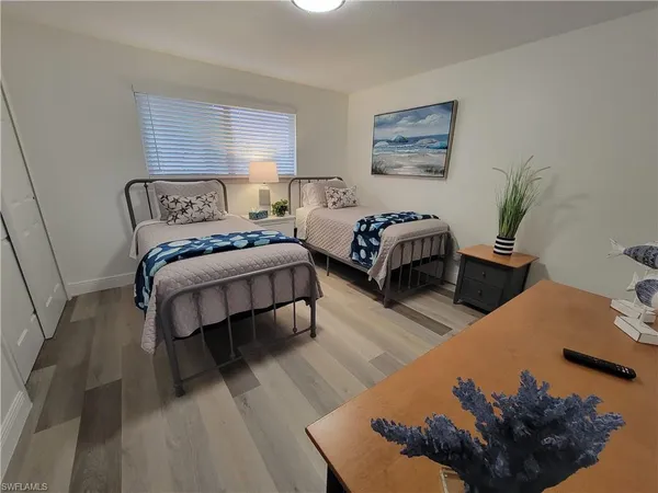 a bedroom with bed and a couch