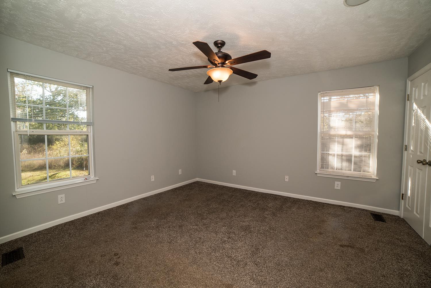 13623 Versailles Road Rockvale, TN 37153 - Photo 7 of 10 an empty room with a window and a fan