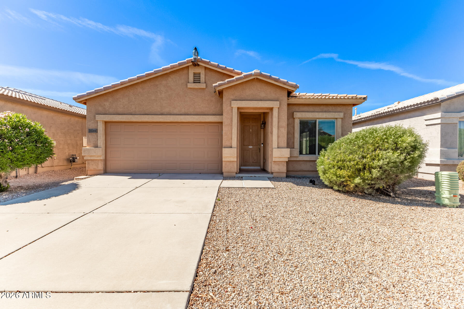 28314 North Crimm Road San Tan Valley, AZ 85143 - Photo 2 of 31 a front view of a house with a yard and garage