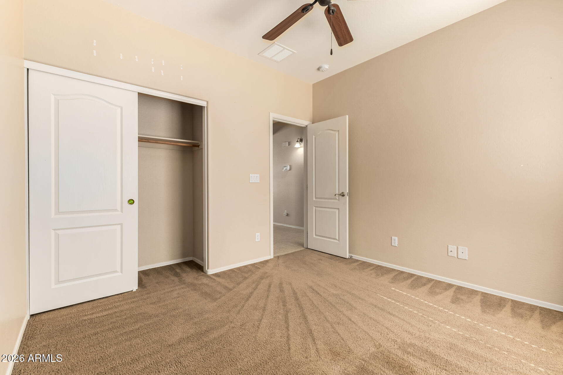 28314 North Crimm Road San Tan Valley, AZ 85143 - Photo 24 of 31 a view of empty room with wooden floor and fan