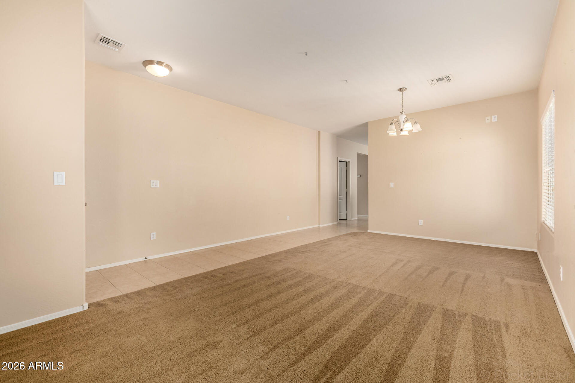 28314 North Crimm Road San Tan Valley, AZ 85143 - Photo 7 of 31 an empty room with wooden floor and windows
