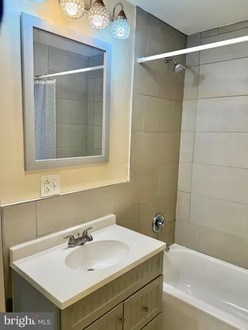 a bathroom with a sink and a bathtub