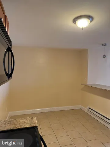 a view of a room with rack and wooden floor