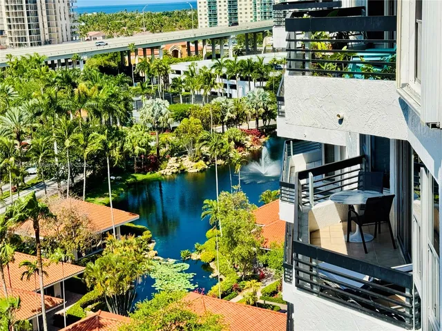 a view of a swimming pool with a garden and plants