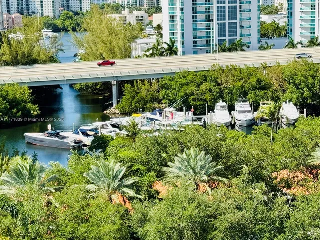 a living room with kitchen furniture and a large window