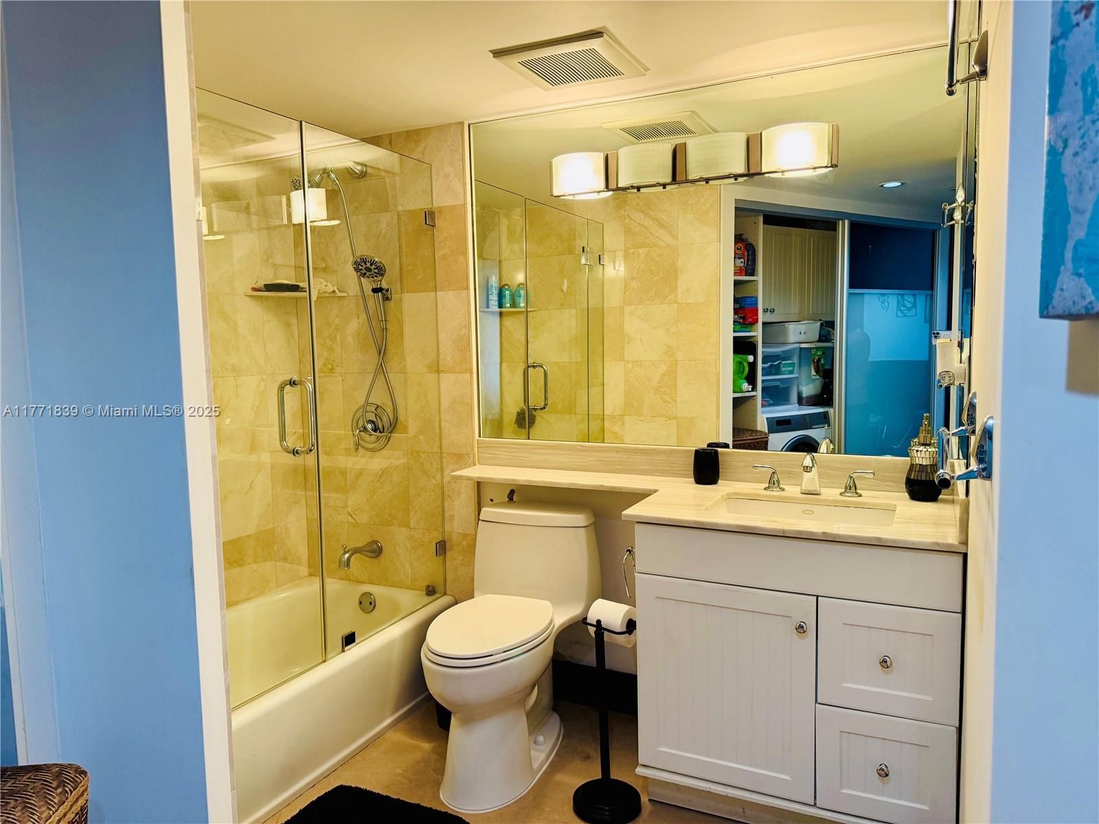 3600 Mystic Pointe Drive, Unit 1210 Aventura, FL 33180 - Photo 21 of 68 a bathroom with a sink a toilet and shower