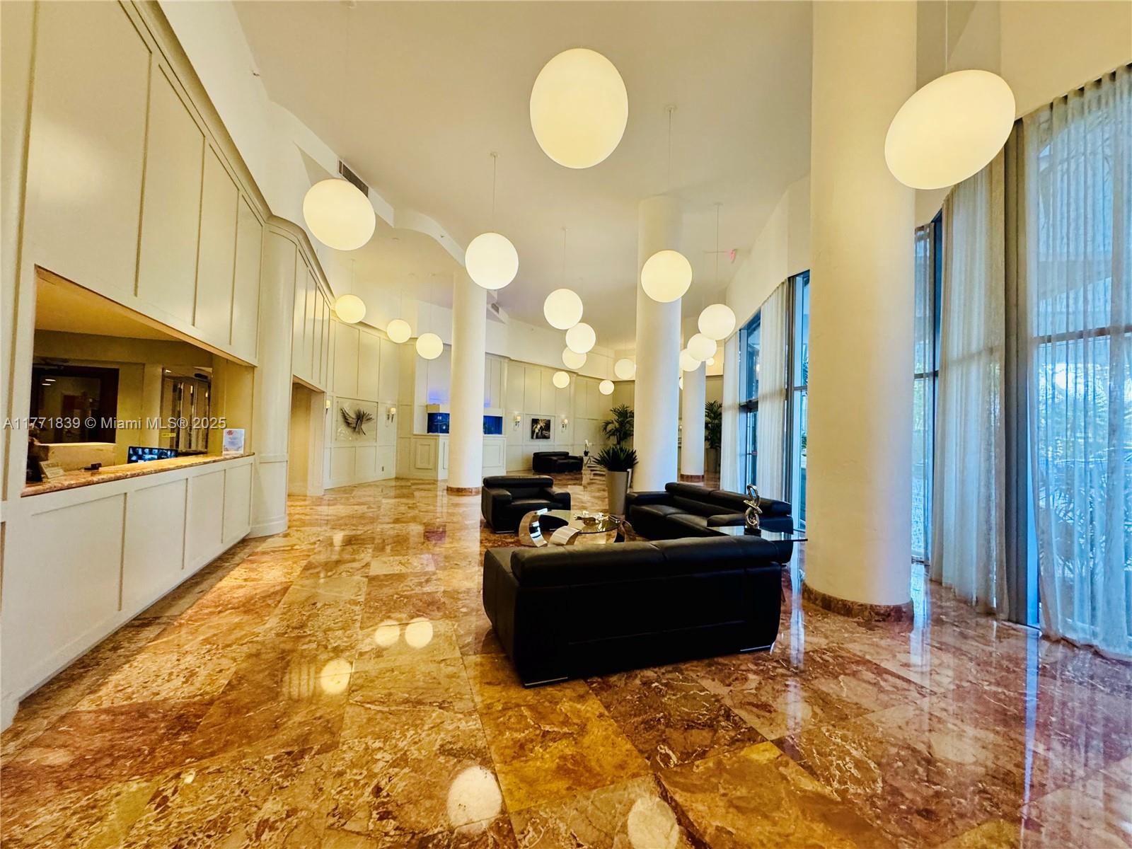 3600 Mystic Pointe Drive, Unit 1210 Aventura, FL 33180 - Photo 34 of 68 a living room with kitchen furniture and a large window