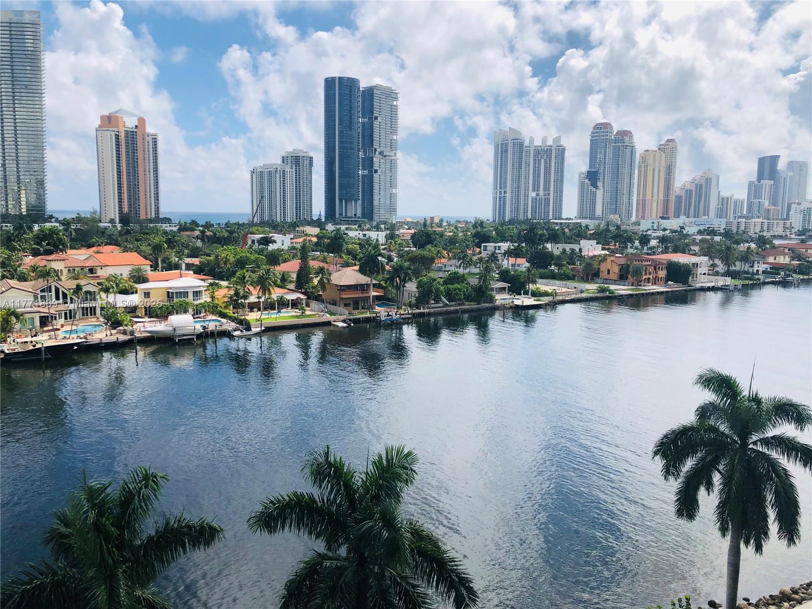 3600 Mystic Pointe Drive, Unit 1210 Aventura, FL 33180 - Photo 59 of 68 a view of a city with tall trees