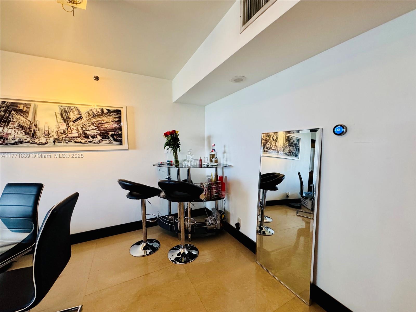 3600 Mystic Pointe Drive, Unit 1210 Aventura, FL 33180 - Photo 10 of 68 a view of a workspace with furniture and a window