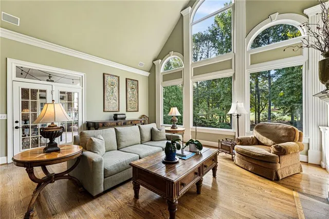 a kitchen with stainless steel appliances granite countertop a sink a stove and a wooden cabinets