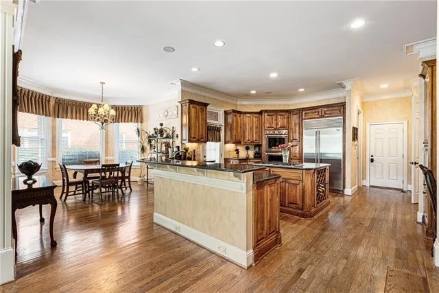 a balcony with furniture and a potted plant
