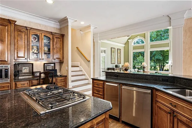 a spacious bathroom with a granite countertop tub sink shower and mirror