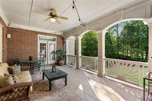 a spacious bathroom with a granite countertop tub sink a mirror a shower and vanity