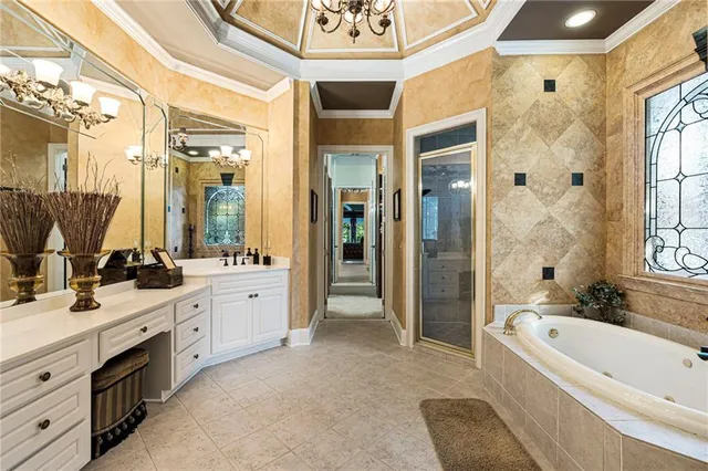 a view of a room with lots of white furniture and stairs