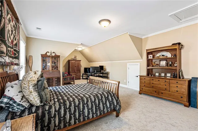 a living room with furniture large window and a fireplace