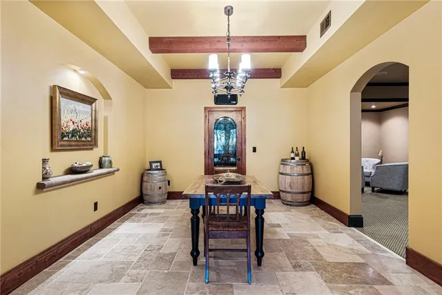 an aerial view of a house with a swimming pool outdoor seating and yard