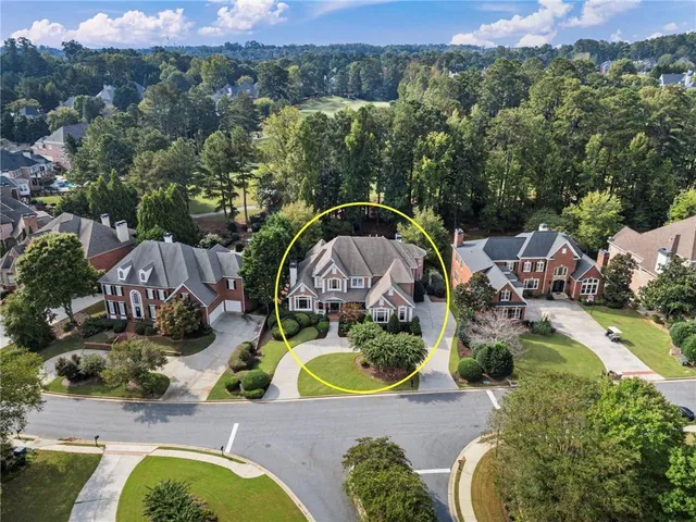 a picture of outdoor space with seating area and trees
