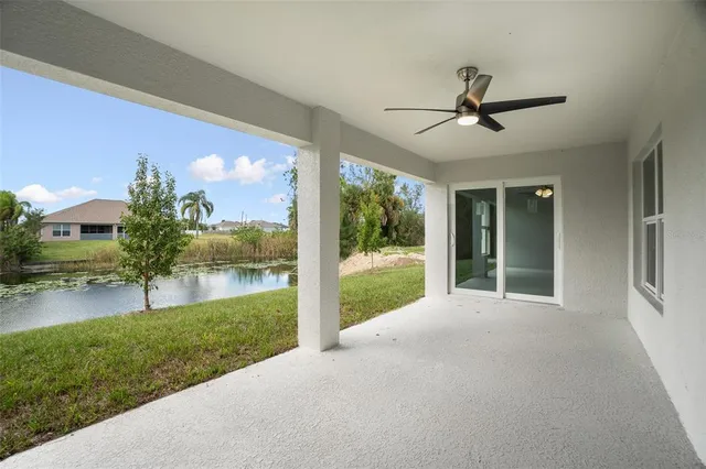 a view of a porch with furniture and garden