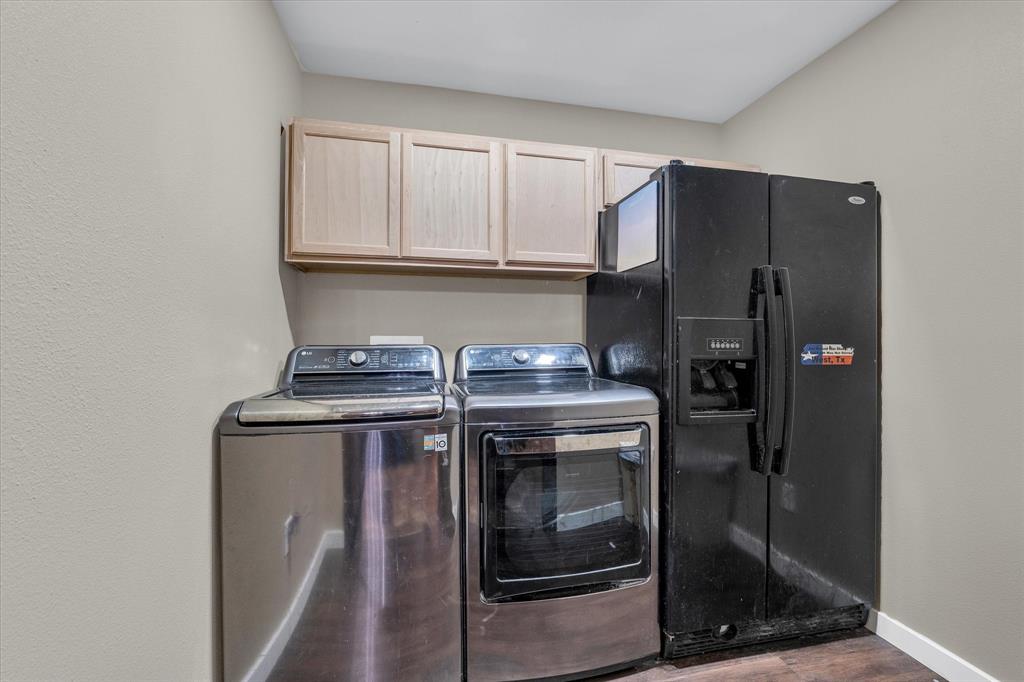 421 Huey Avenue Mount Calm, TX 76673 - Photo 11 of 39 a kitchen with a stove and a refrigerator
