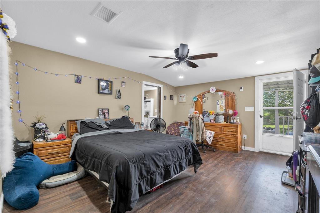 421 Huey Avenue Mount Calm, TX 76673 - Photo 17 of 39 a bed room with a bed and a large window
