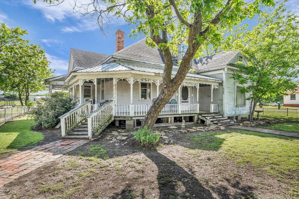 421 Huey Avenue Mount Calm, TX 76673 - Photo 26 of 39 a front view of a house with garden
