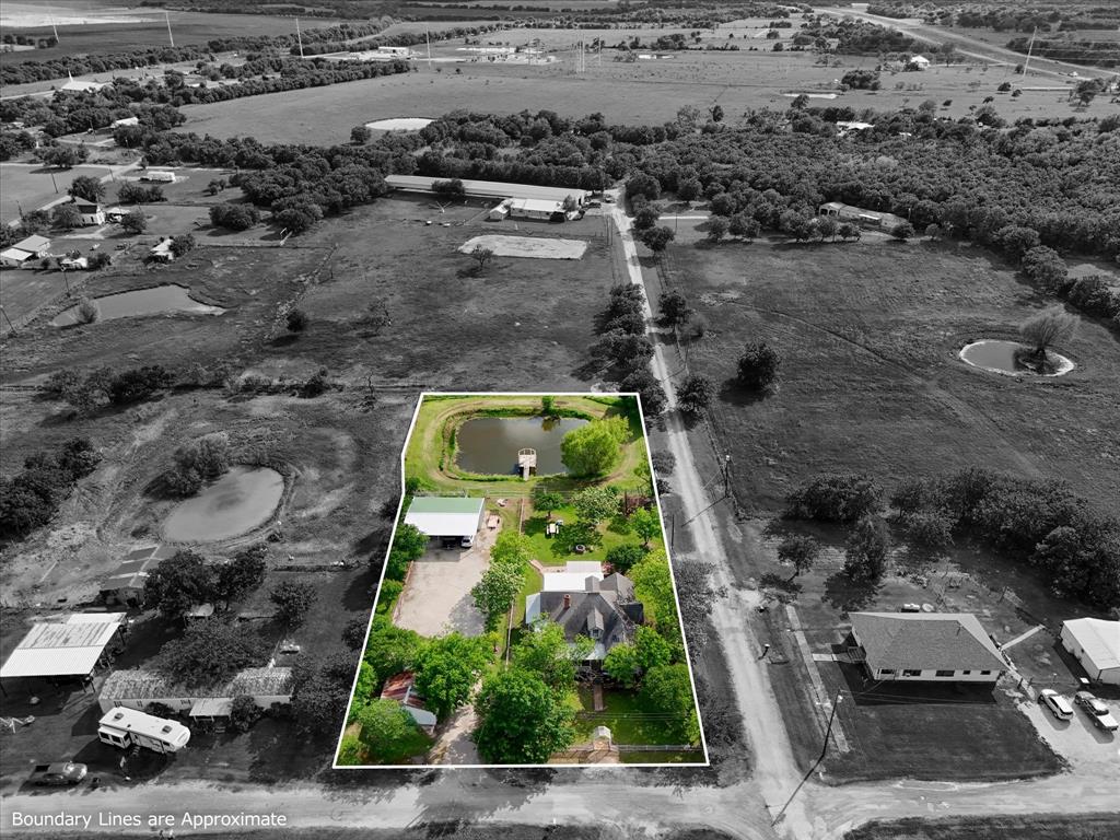 421 Huey Avenue Mount Calm, TX 76673 - Photo 3 of 39 an aerial view of residential house with outdoor space
