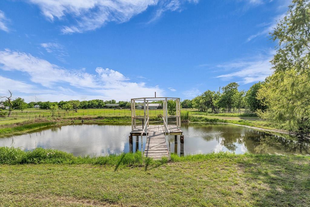 421 Huey Avenue Mount Calm, TX 76673 - Photo 32 of 39 a view of a lake with houses in the back
