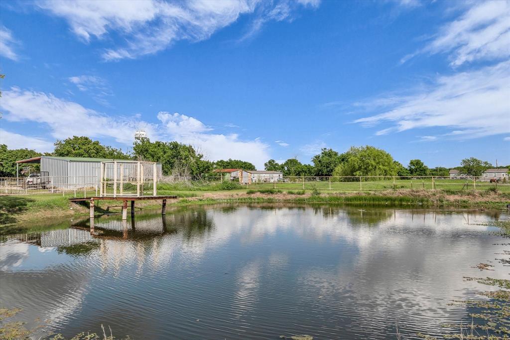421 Huey Avenue Mount Calm, TX 76673 - Photo 33 of 39 a view of a lake with houses in the back