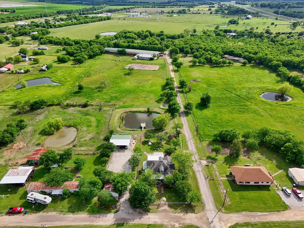 421 Huey Avenue Mount Calm, TX 76673 - Photo 6 of 39 a view of a garden with a lake