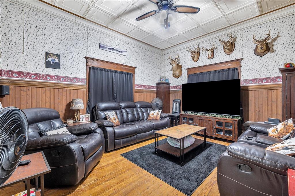 421 Huey Avenue Mount Calm, TX 76673 - Photo 7 of 39 a living room with furniture and a flat screen tv