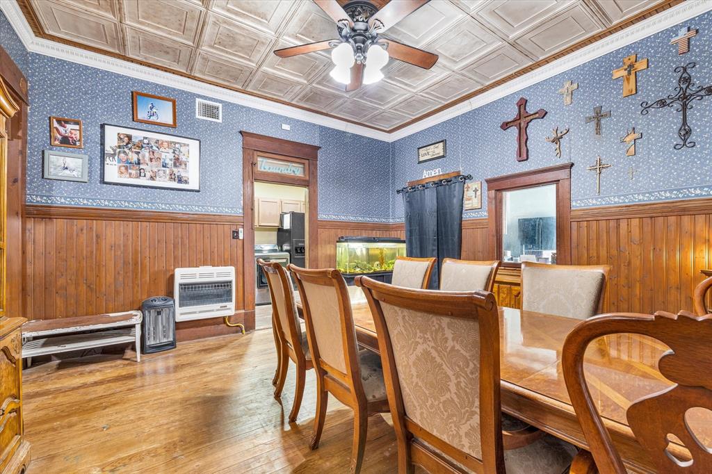 421 Huey Avenue Mount Calm, TX 76673 - Photo 10 of 39 a view of a dining room with furniture window and wooden floor