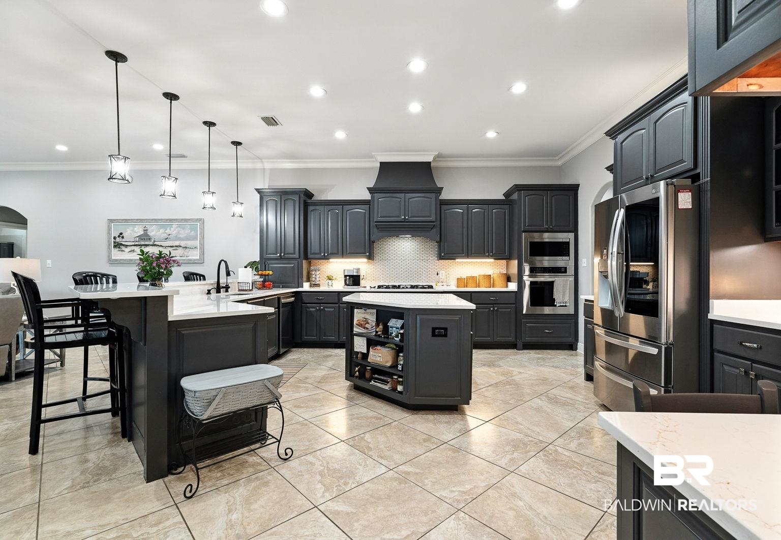 23357 Carnoustie Drive Foley, AL 36535 - Photo 31 of 99 Kitchen with a peninsula, crown molding, appliances with stainless steel finishes, decorative backsplash, and recessed lighting