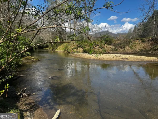a view of swimming pool with a yard