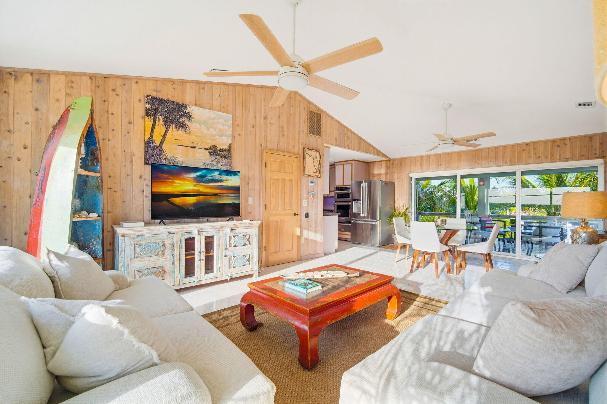403 Indies Road Summerland Key, FL 33042 - Photo 14 of 68 a living room with furniture a flat screen tv and a large window