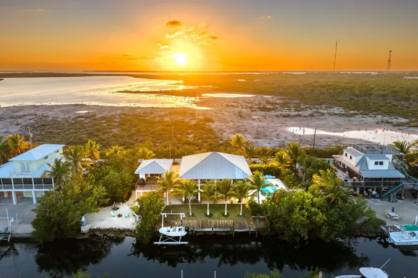 a view of a park with swings and a table