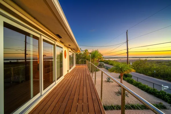 a view of a swimming pool with chairs