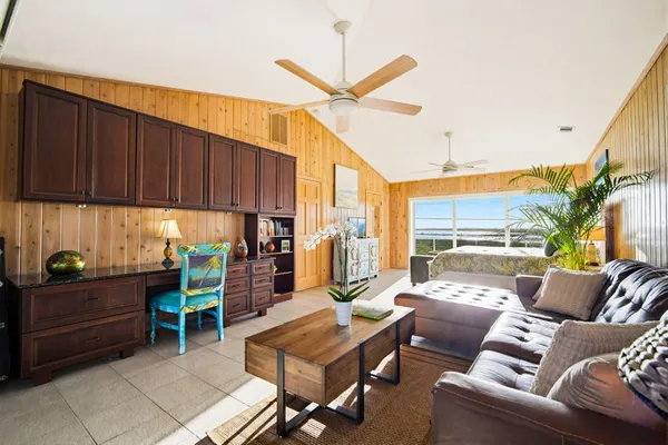 an aerial view of a house with a yard and garden